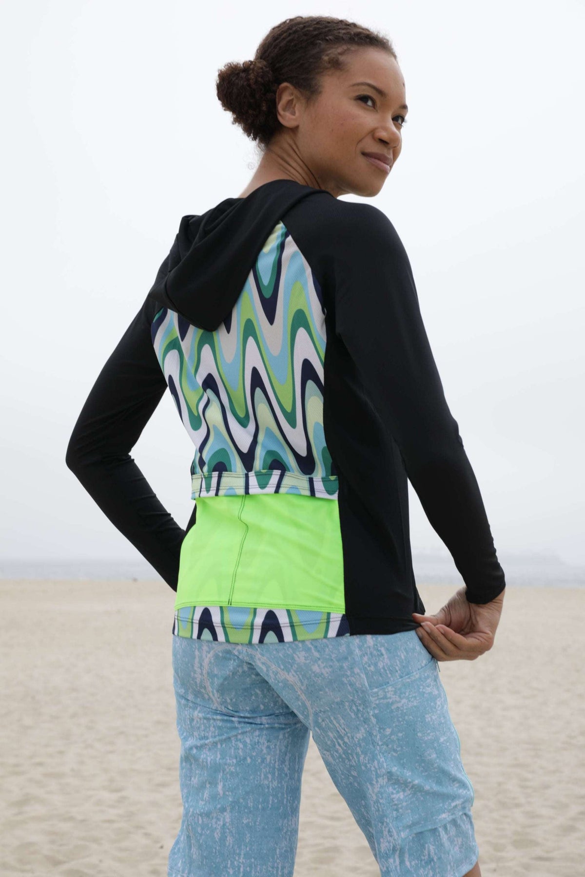 Moxie Hoodie High Visibility Color Wave with moisture-wicking fabric, bright design, and perforated mesh for quick dry and endurance.