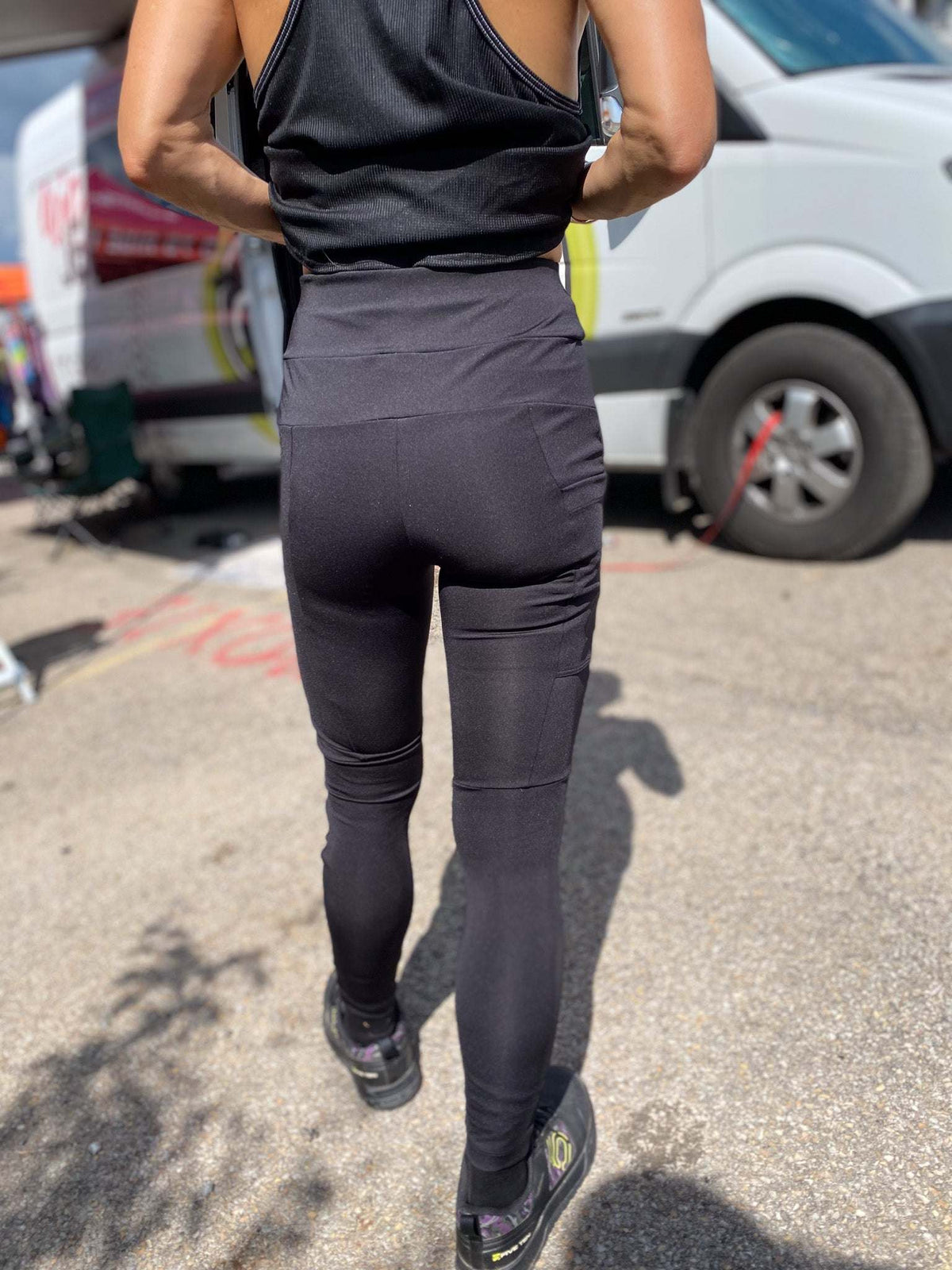 Versatile black cycling pants with side pockets and yoga waistband for comfort and flexibility.