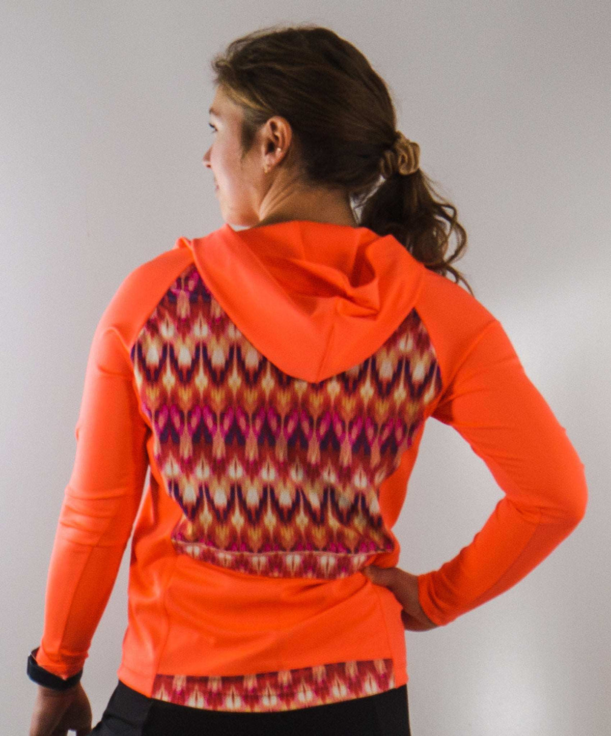 Moxie Tee Heavier Weight hoodie, orange long sleeve bike jersey, moisture-wicking, high visibility.