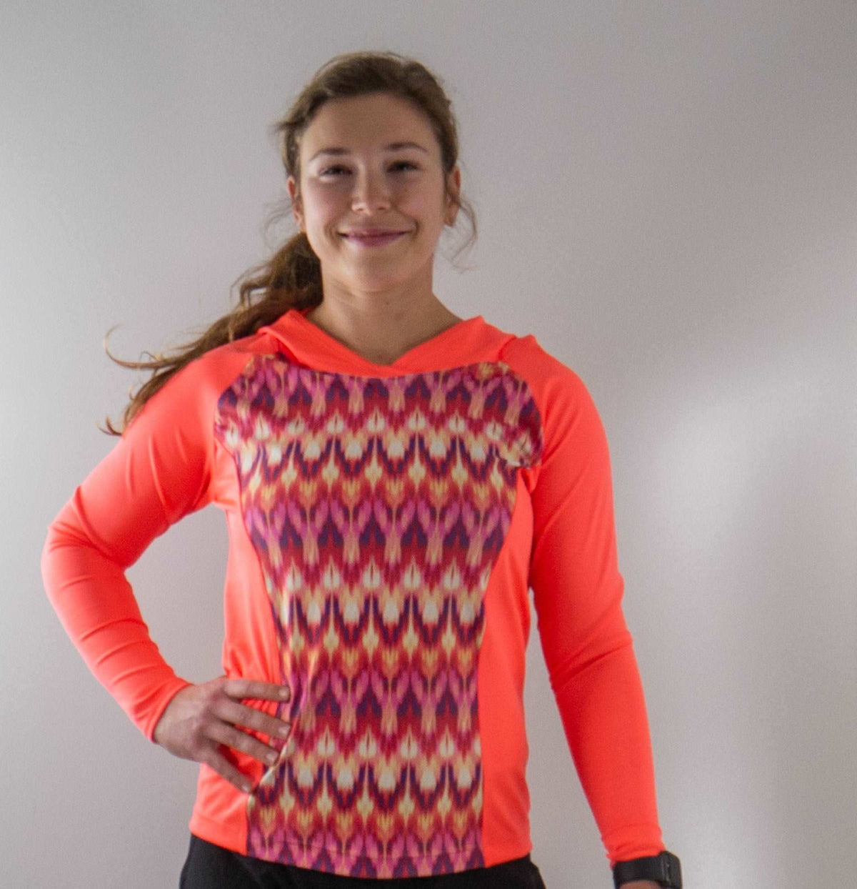 Moxie Tee Heavier Weight hoodie in bright colors with a vibrant, patterned front panel.
