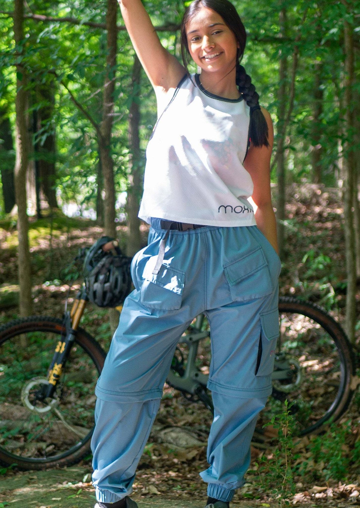 Women's conversion cargo mountain bike pants in dusty blue designed for versatile summer riding and technical performance