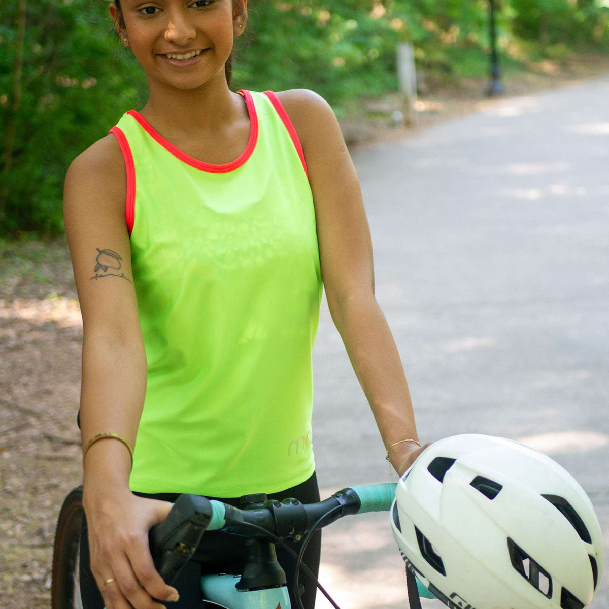 Women's sleeveless bike jersey in high vis colors with back pocket for essentials