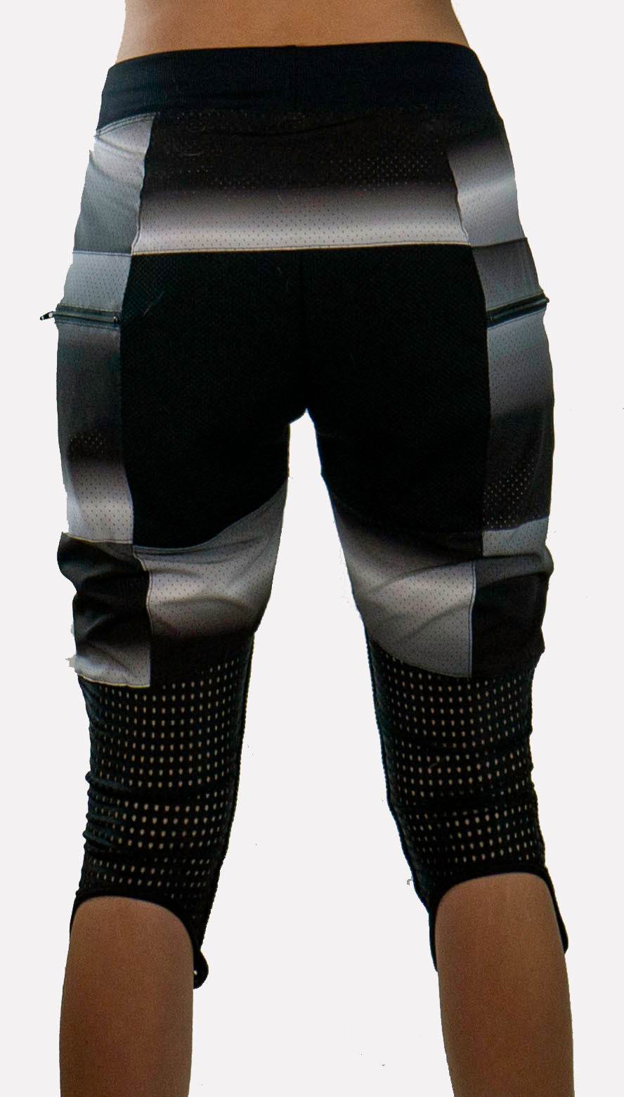 Rear view of black and gray bike pants with mesh detailing and removable G-Form knee pads designed for durability and breathability