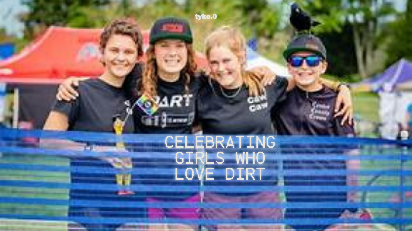 Group of smiling girls at outdoor cycling event promoting support for PICL and girls who love dirt biking