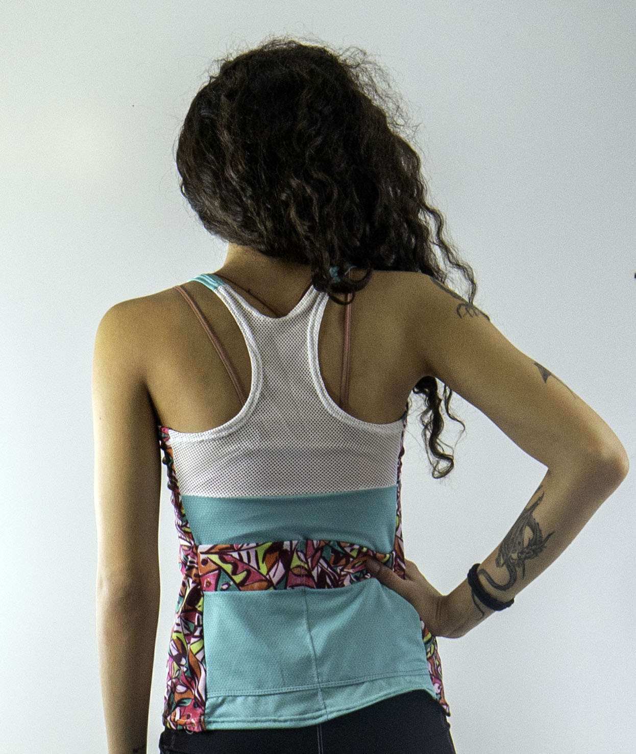 Racerback Fifi with mesh back detail, two pockets, and colorful design.