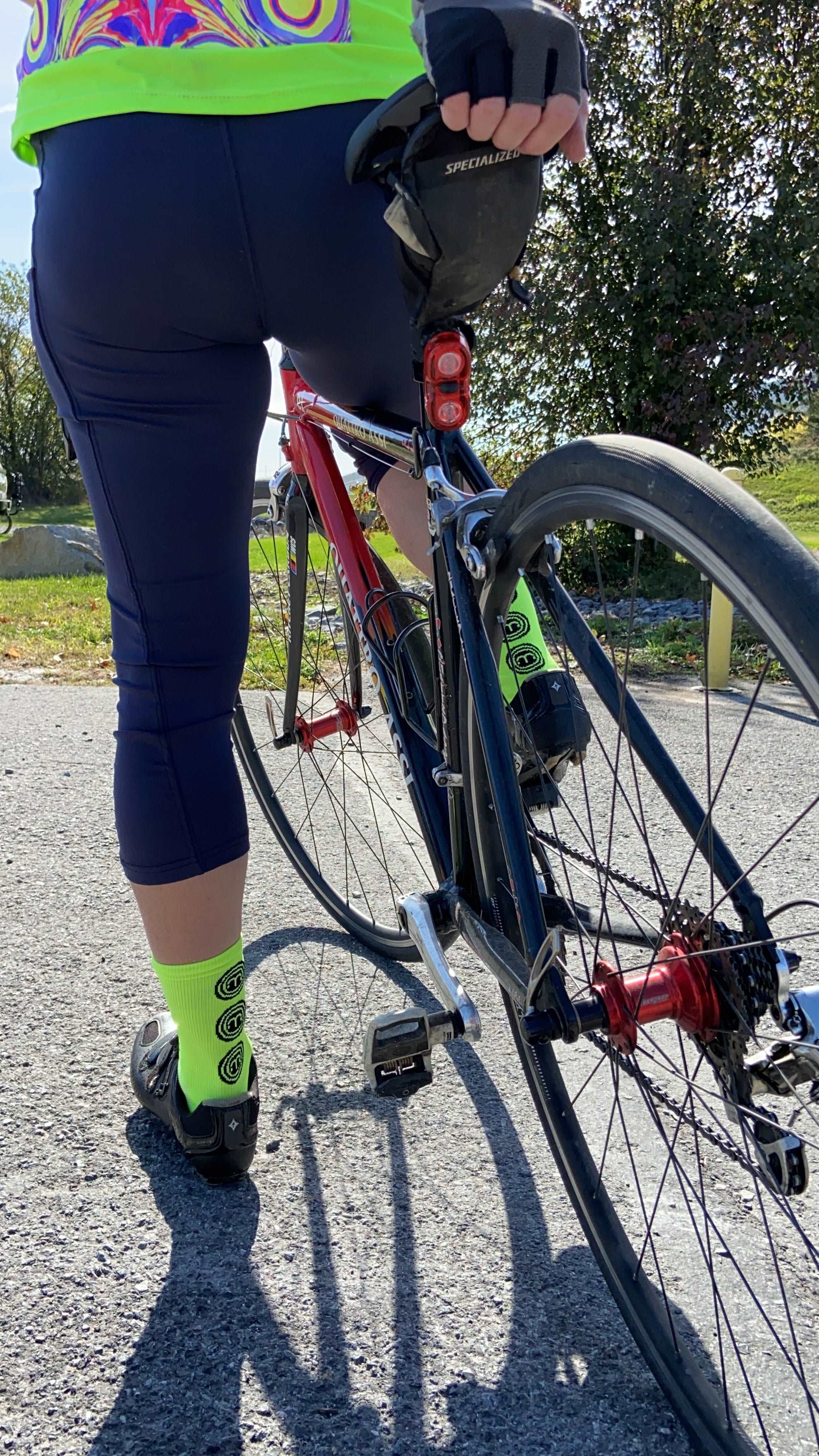 Bright Hi Vis Moxie Socks on cyclist with road bike.