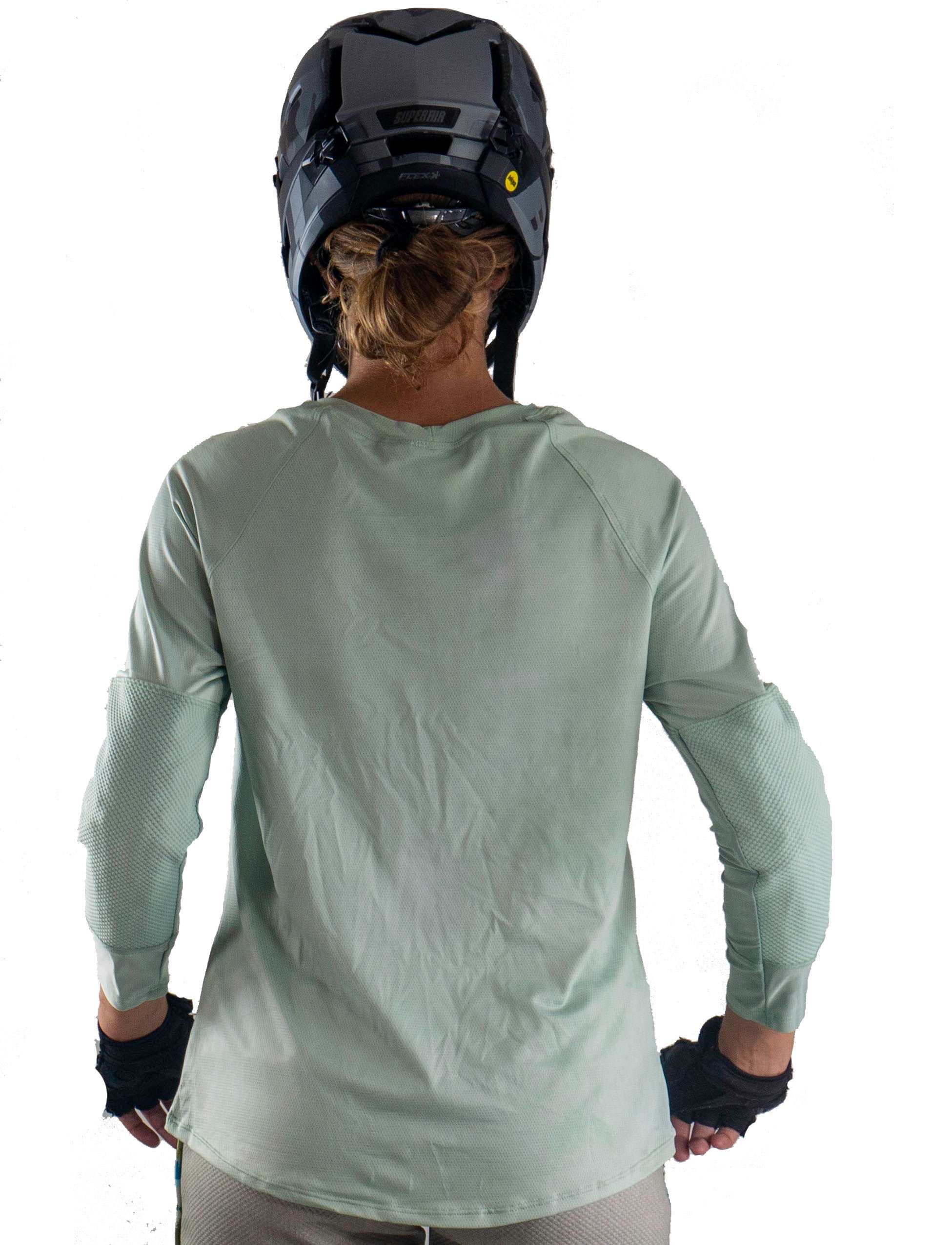 Mountain Bike Jersey Moss with elbow pad pockets, worn by cyclist.