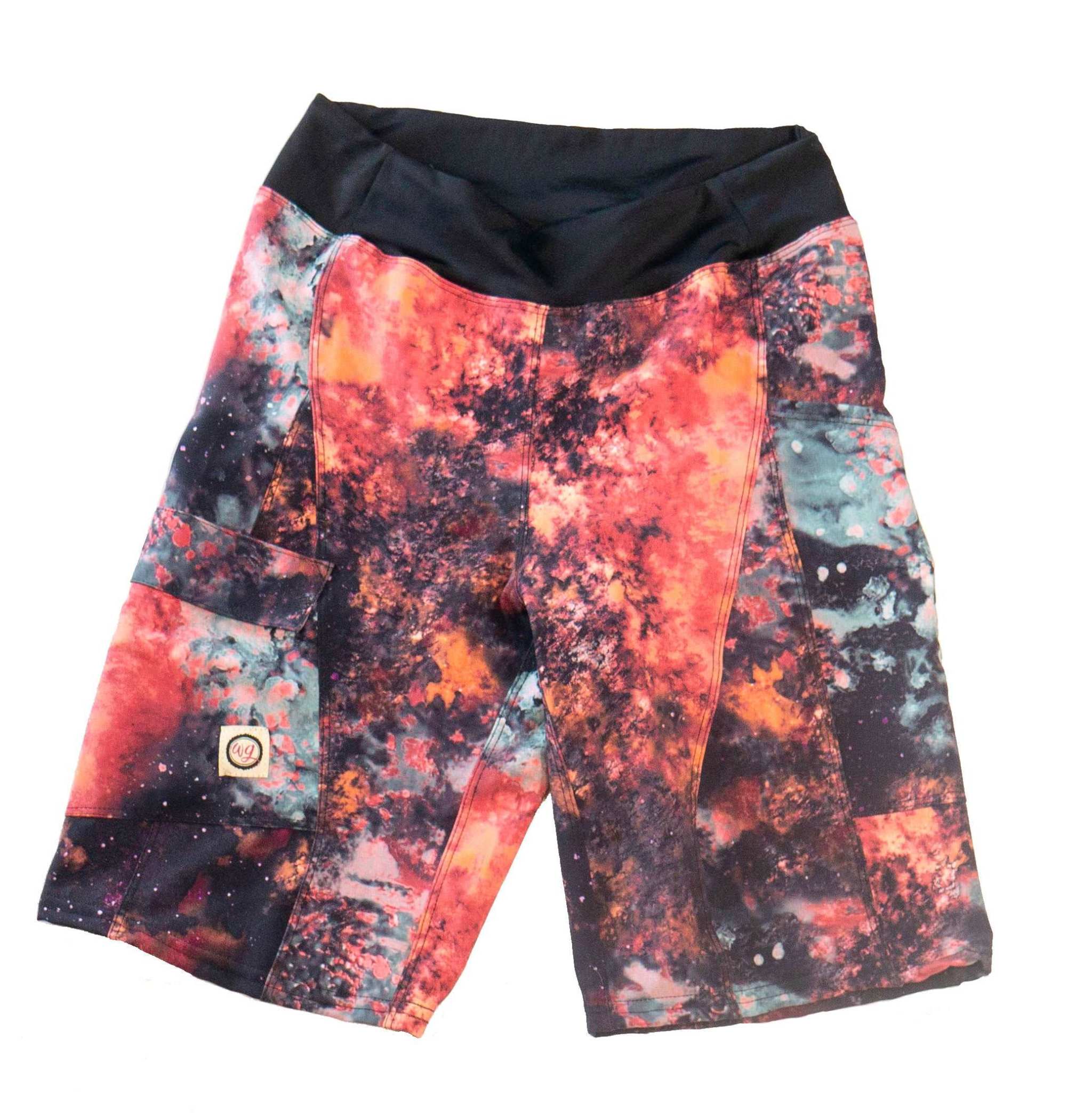 Women's mountain bike short, fire pattern, contoured fit, elastic waistband, versatile pockets, moisture-wicking fabric.