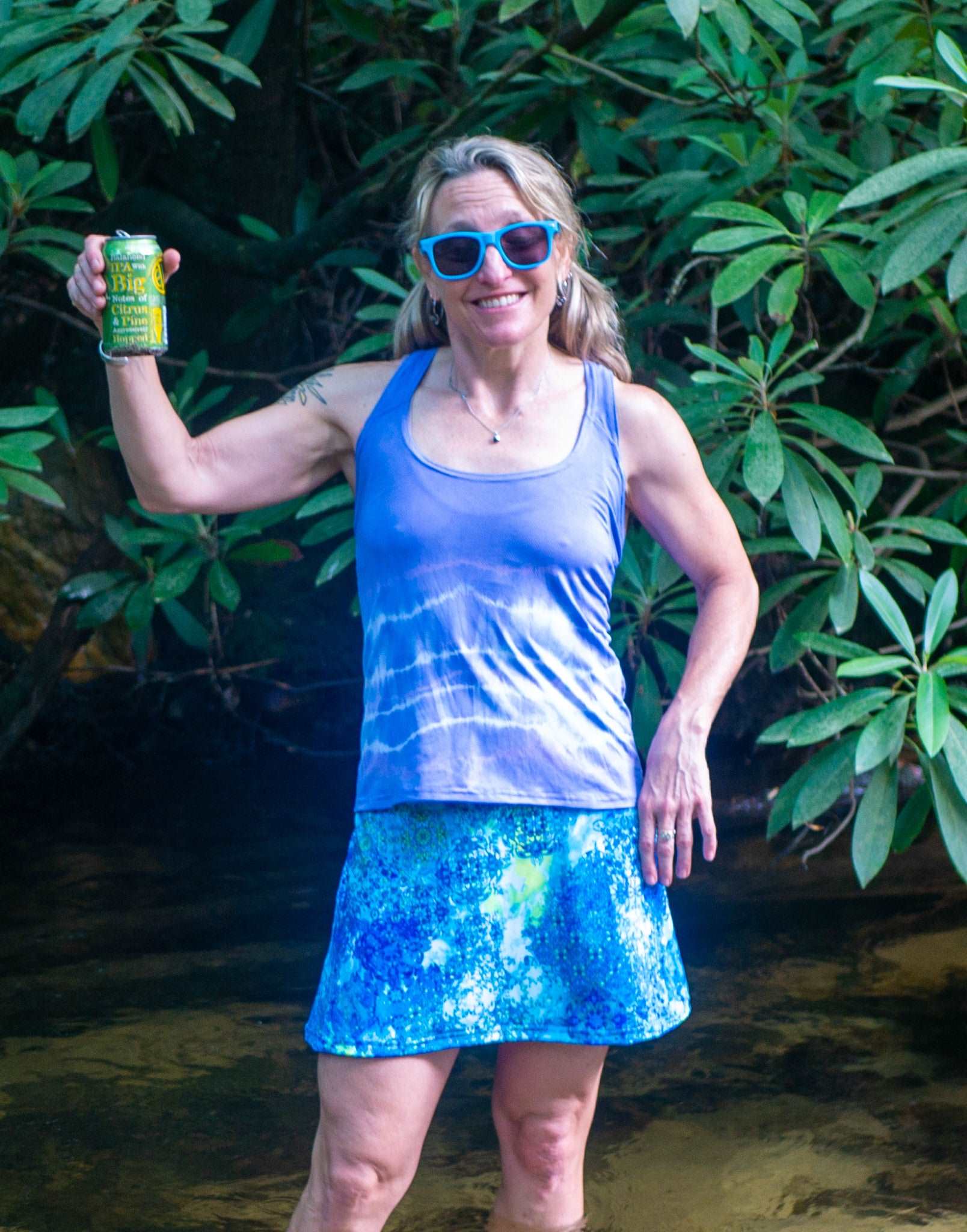 Sports Skirt- Bluebird modeled outdoors, showcasing lightweight and comfortable fabric with A-line cut.