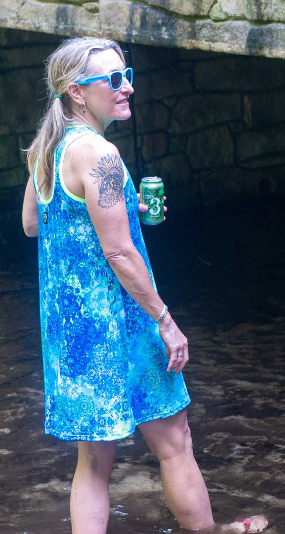 Bluebird sports dress with scoop neckline, A-line cut, and keyhole back, made from lightweight recycled fabric.