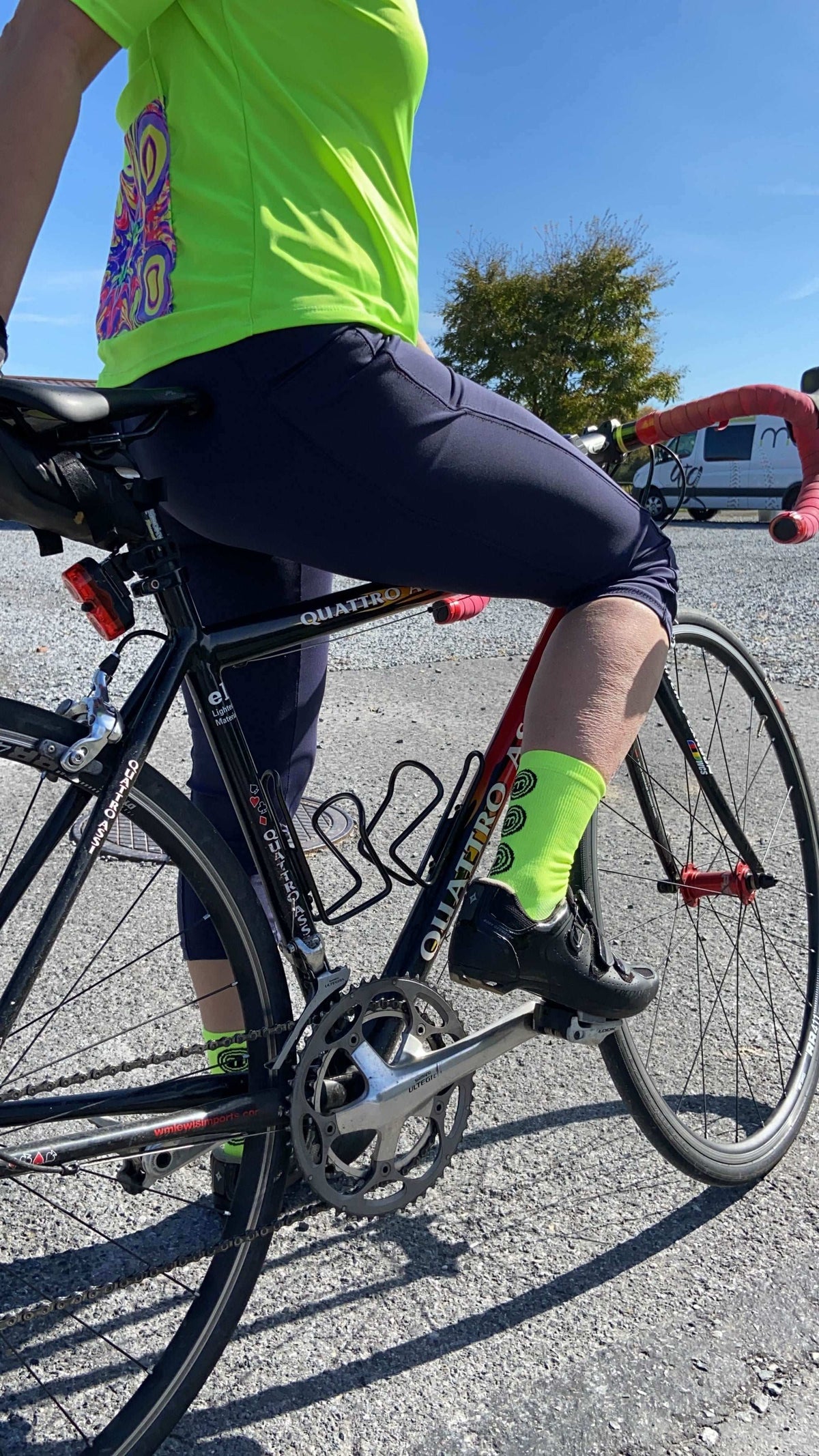 Moxie Socks - Moxie Yellow, moisture-wicking acrylic with 6-inch cuff, worn while cycling.