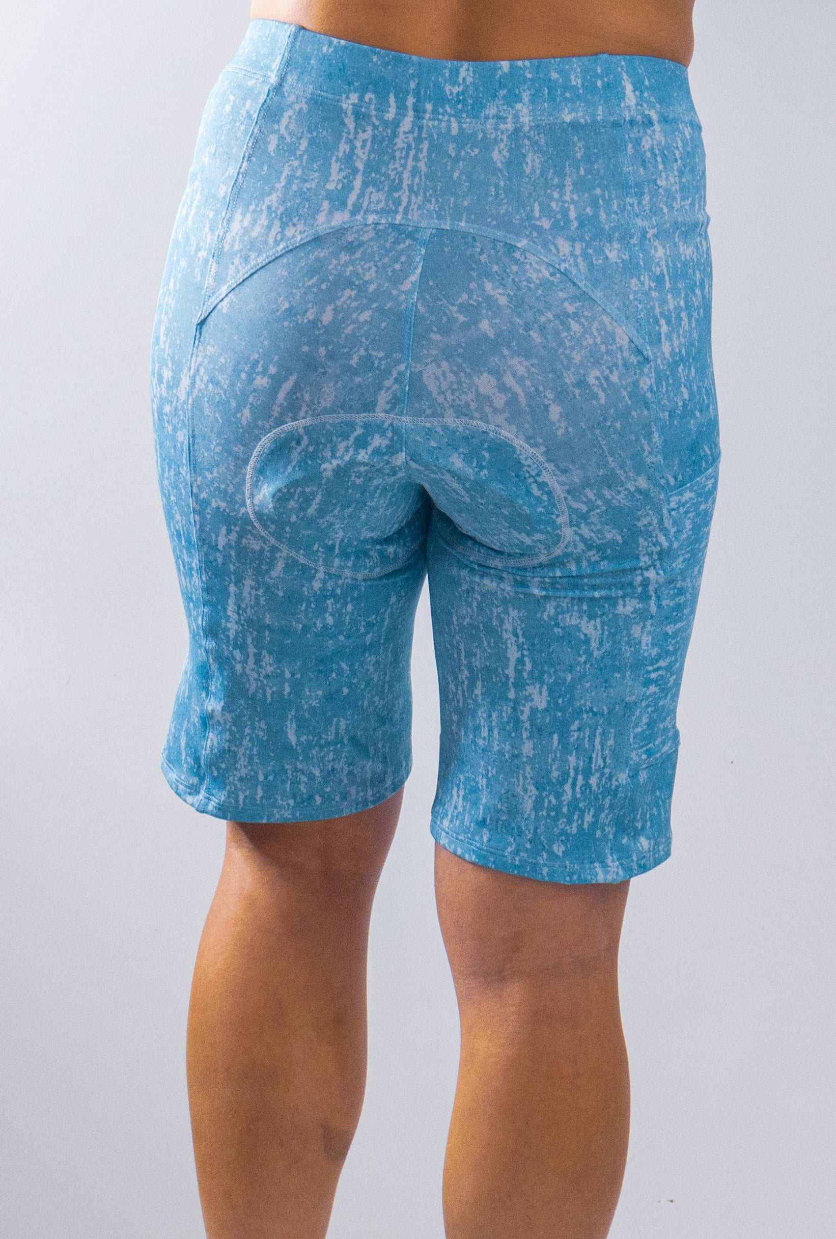 Women's blue mountain bike shorts with Italian chamois, moisture-wicking, and eco-friendly material.