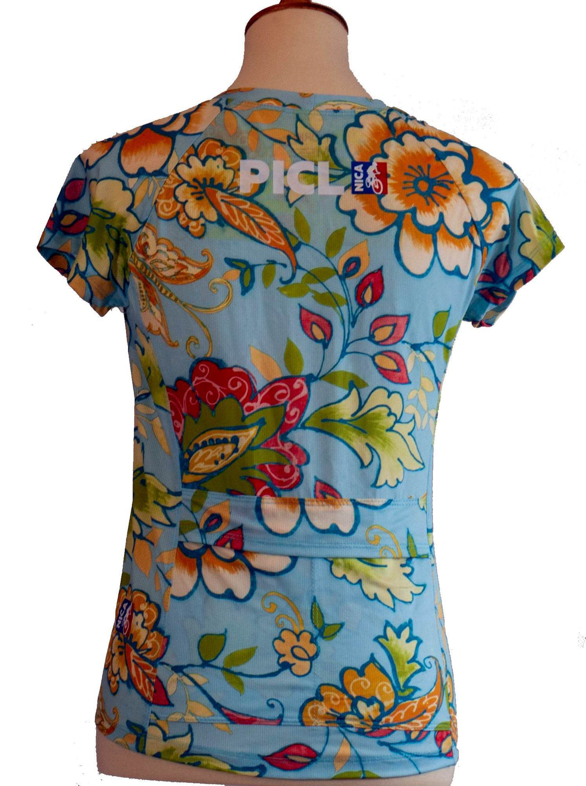 Women's PICL GRiT Tee cycling jersey with colorful floral design and back pockets for essentials