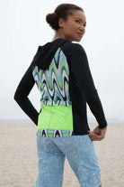 Moxie Hoodie High Visibility Color Wave with moisture-wicking fabric, bright design, and perforated mesh for quick dry and endurance.
