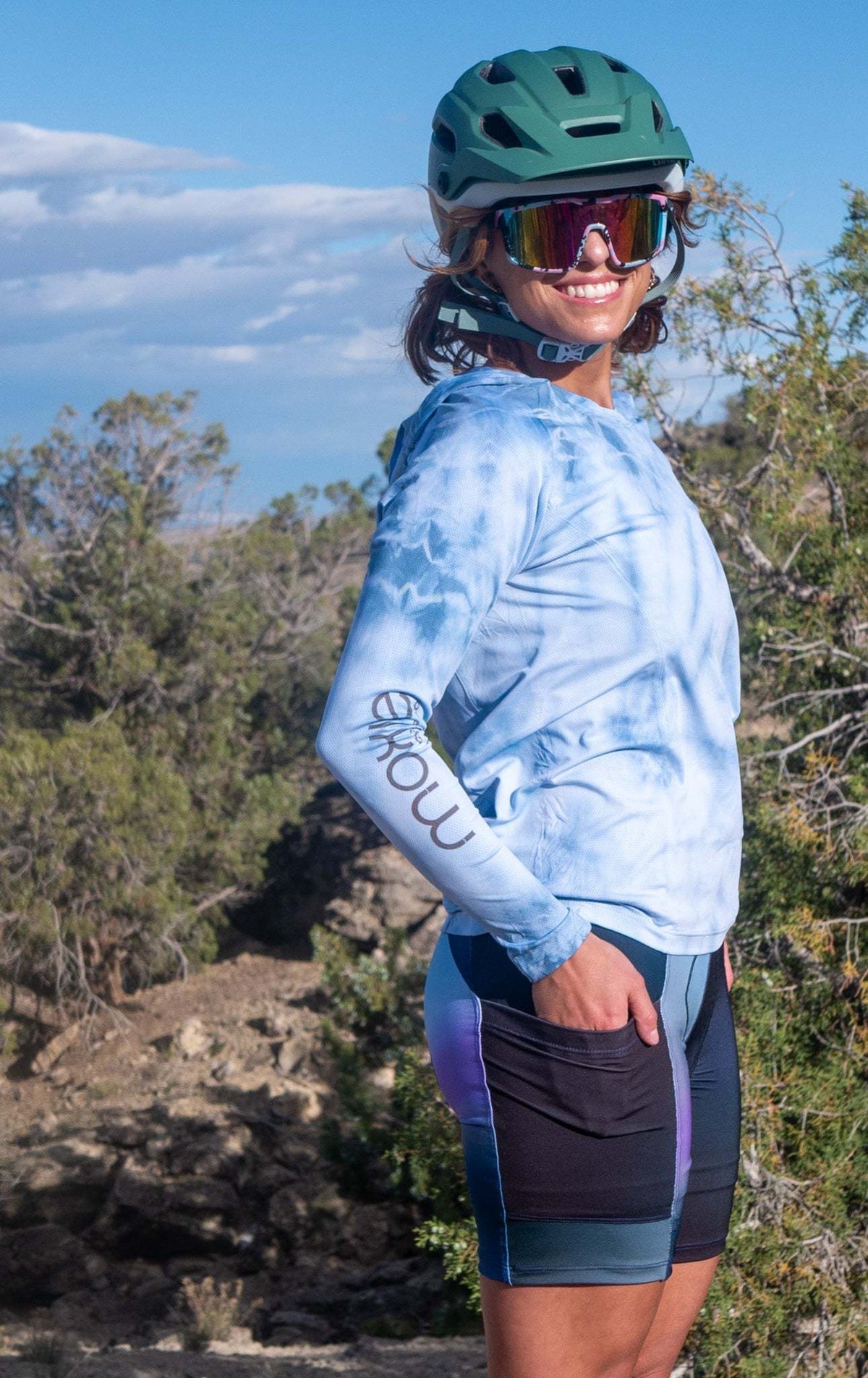 Women's bike shorts with 7" inseam, Italian chamois, cyclist in outdoor setting.