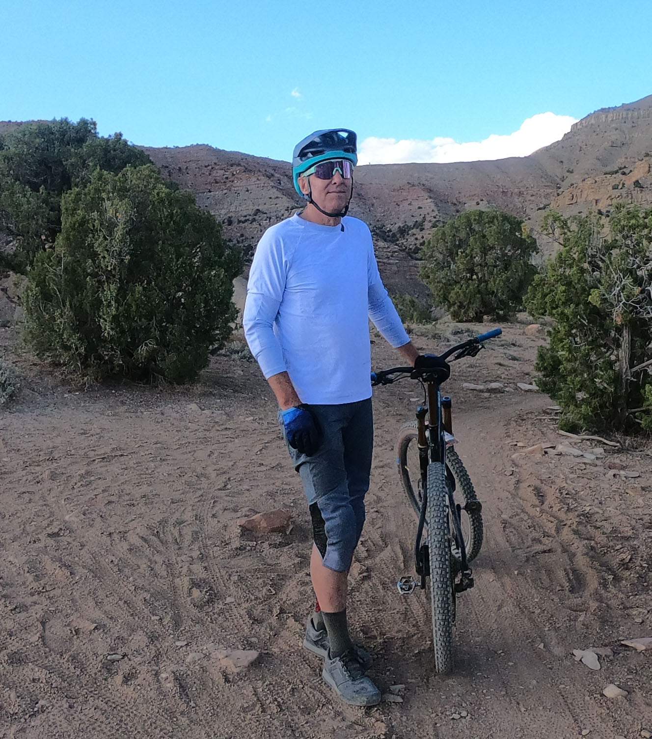 Men's G-Form Mountain Bike Jersey with removable elbow pads in mountain setting.