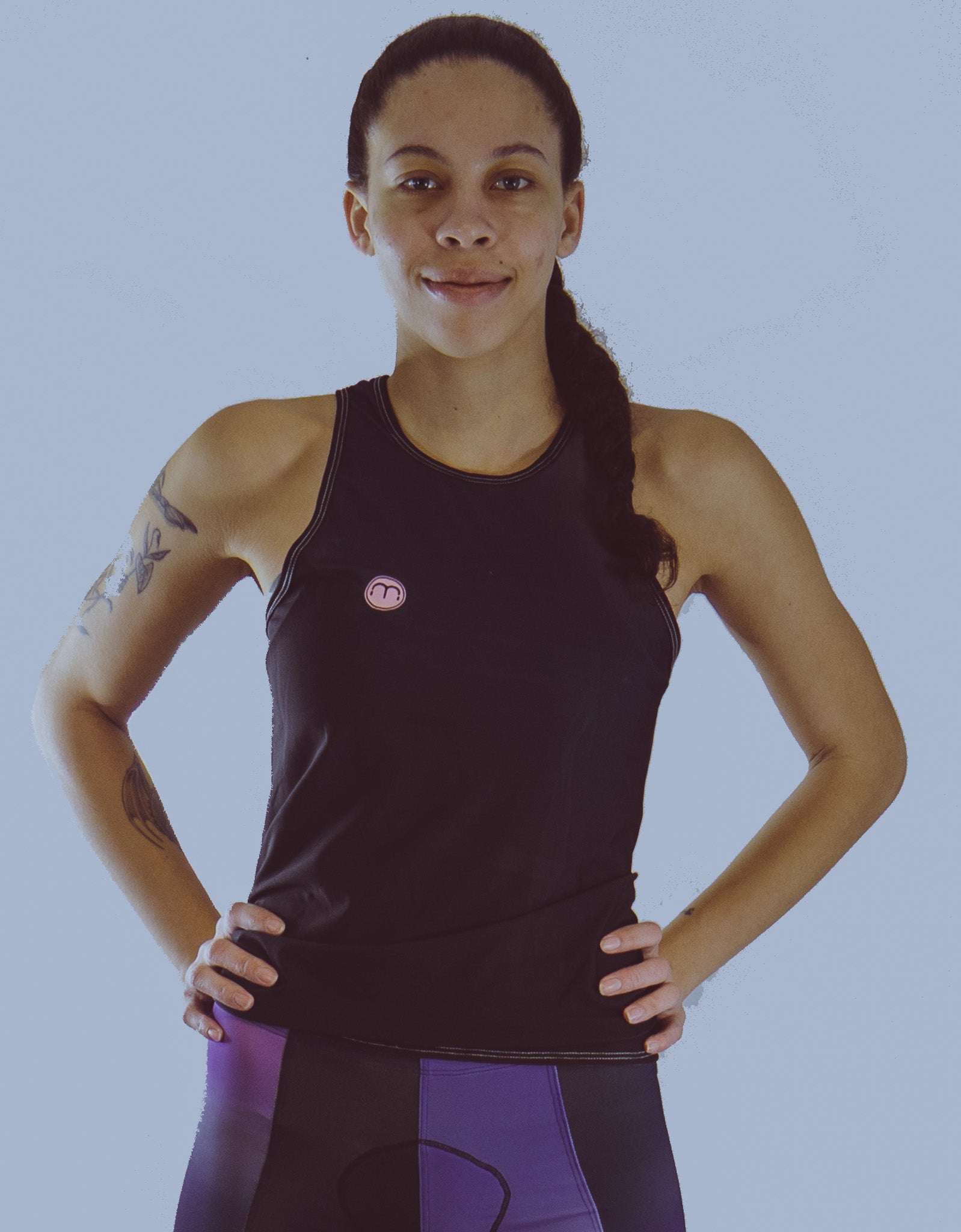 Women's sleeveless bike jersey in black and blue with a breathable mesh fabric, featuring a back pocket.