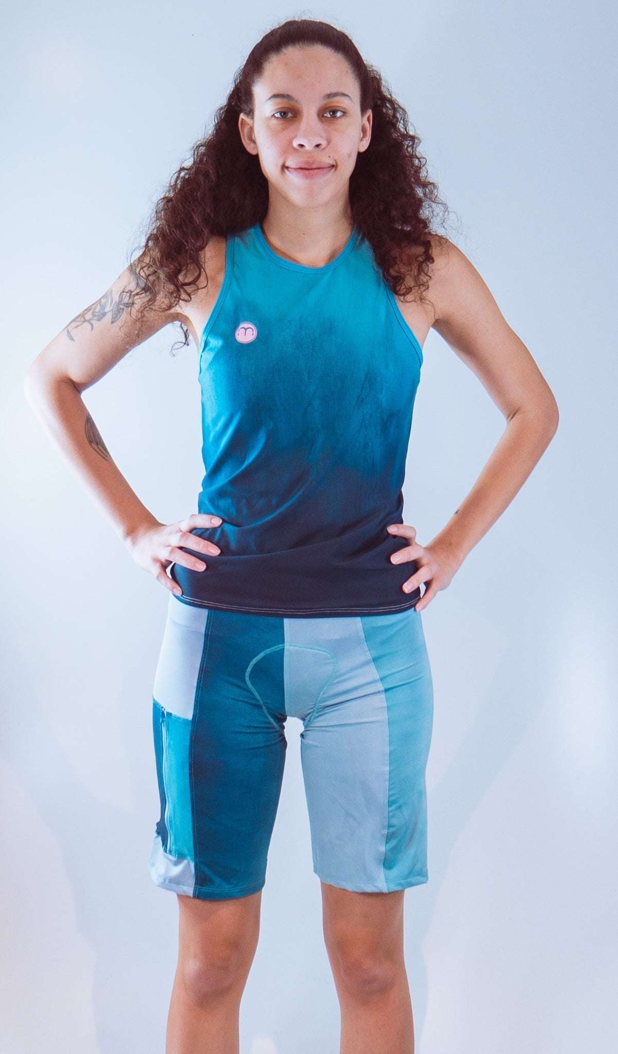 Women's Sleeveless Bike Jersey in black and blue worn by a model.