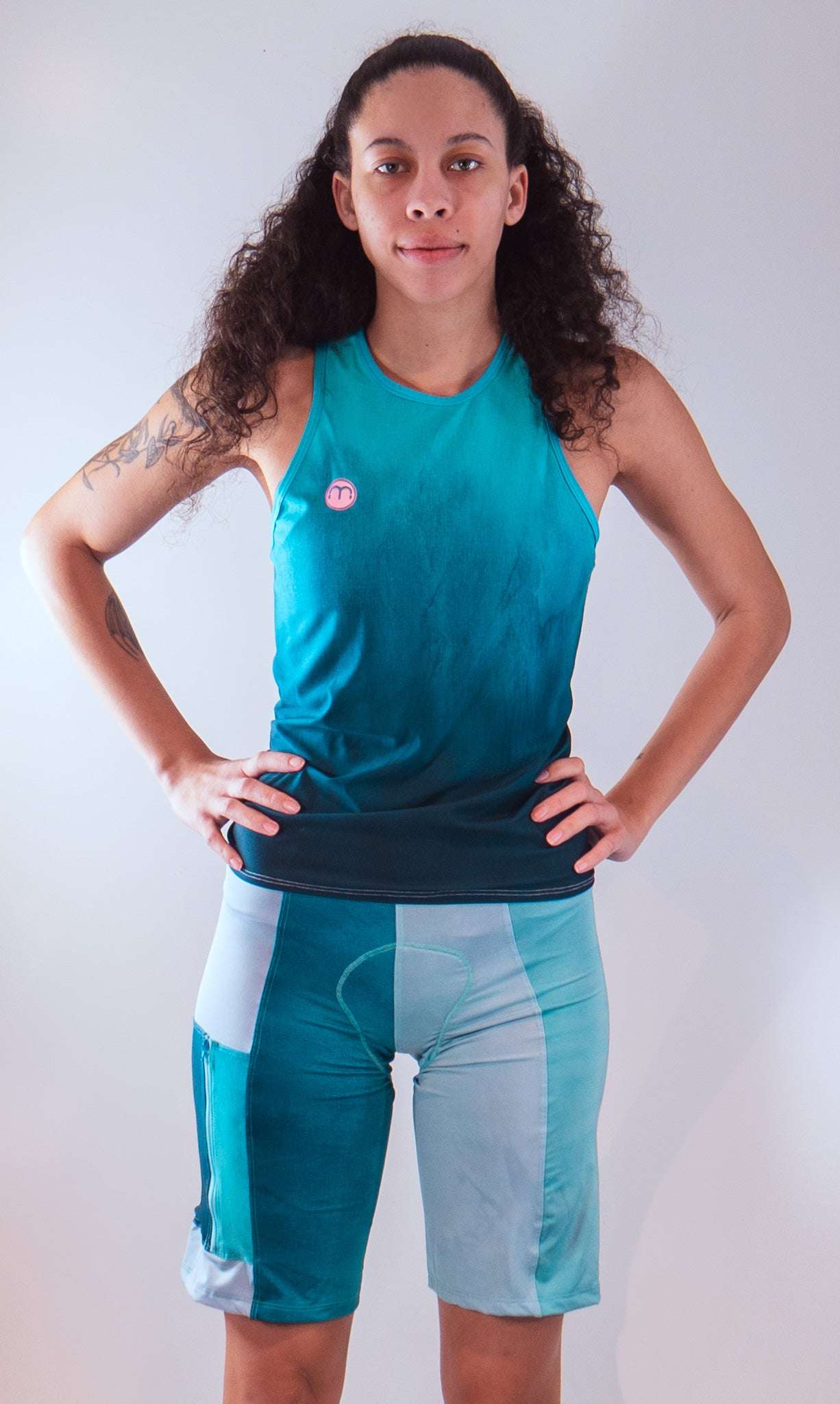 Women's mountain bike shorts with Italian chamois, teal design, tailored fit.