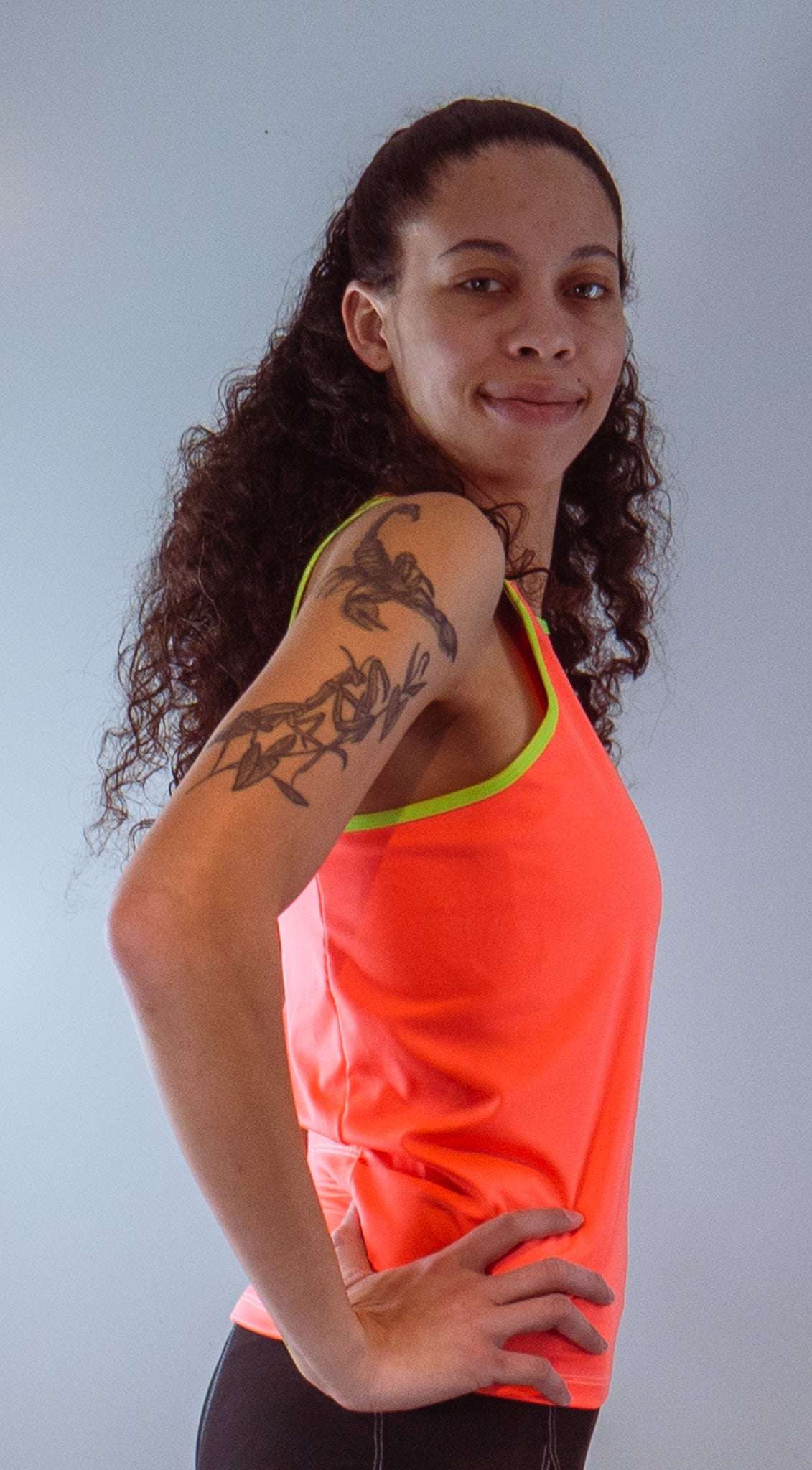 Women's sleeveless bike jersey in high visibility colors with a racerback design.
