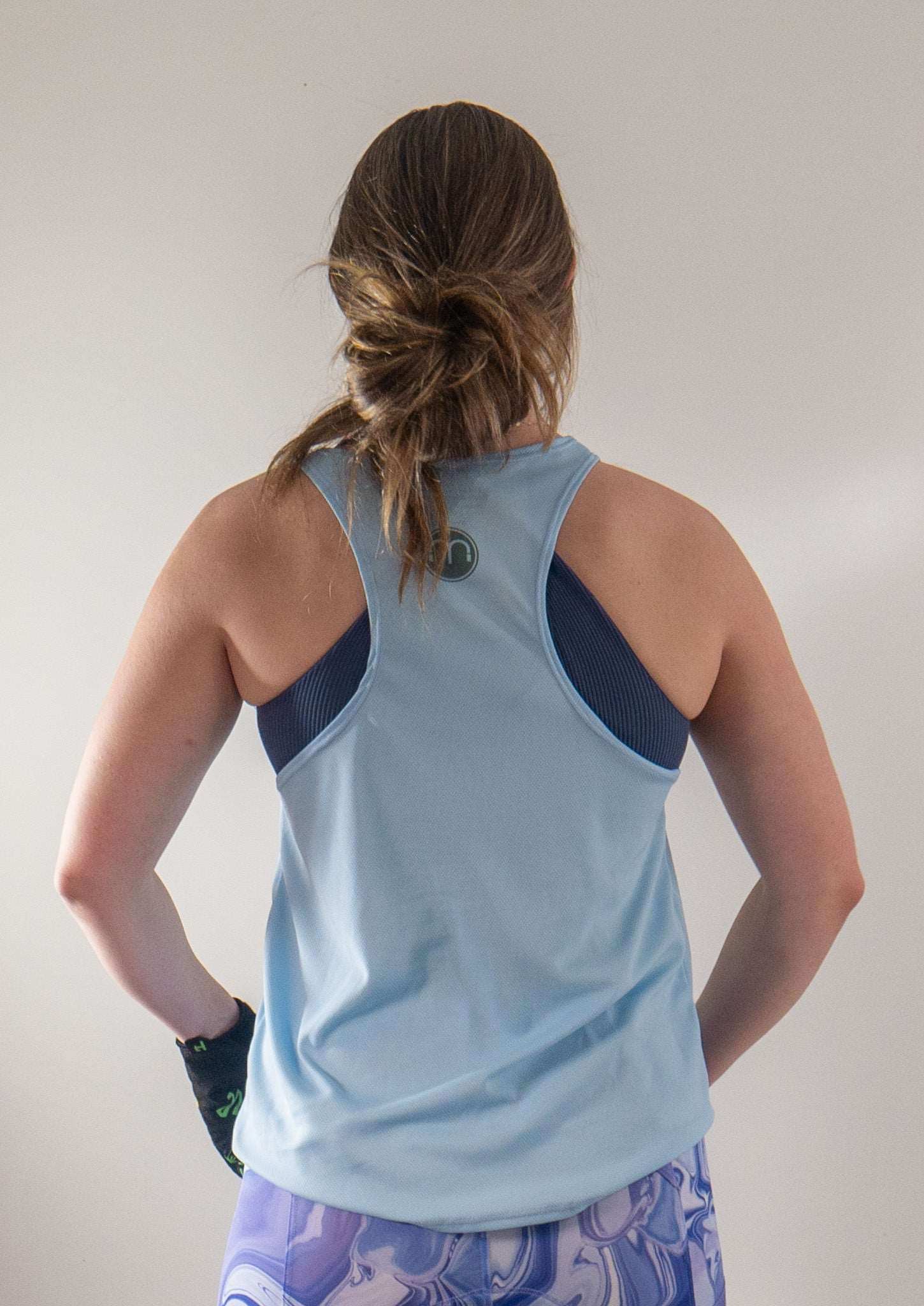 Light blue 'Ride Bikes Be Happy' tank with breathable mesh fabric and loose fit, made in the USA.