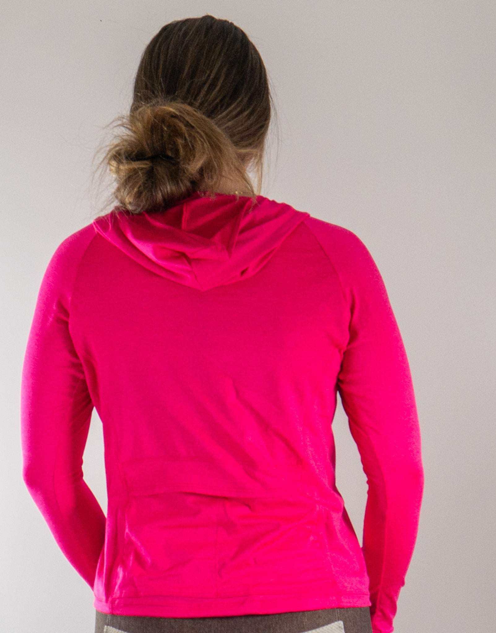 Moxie Heather Hoodie in bright pink with back pockets, ideal for cool weather riding and visibility.
