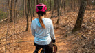 Moxie Sun Saver Hoodie with bike cog graphic in a wooded trail setting.