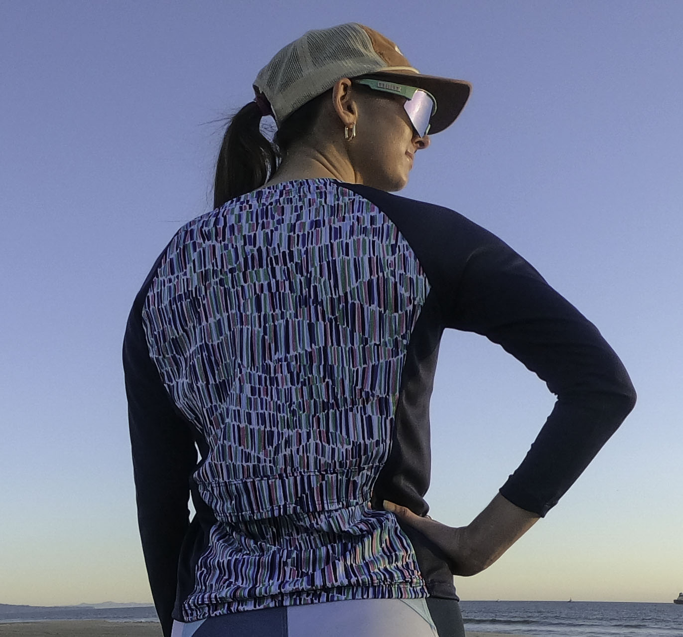 Moxie Tee Jersey Blues Long Sleeve with Purple Paisley design, featuring moisture management technology for endurance on bike rides.