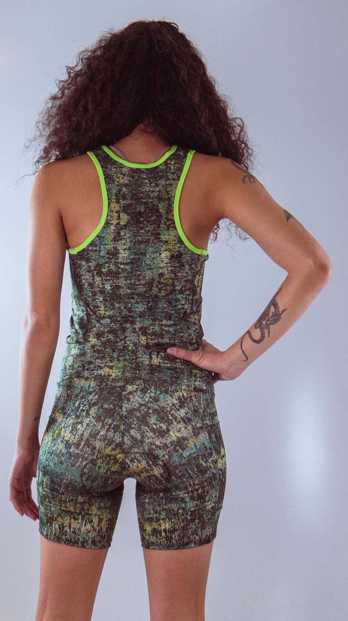 Women's sleeveless bike jersey with colorful wild fire design, breathable mesh fabric, and back pocket.