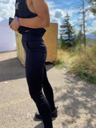 Versatile black bike cycling pants with large pockets, featuring durable stretch fabric and a comfortable yoga waistband.