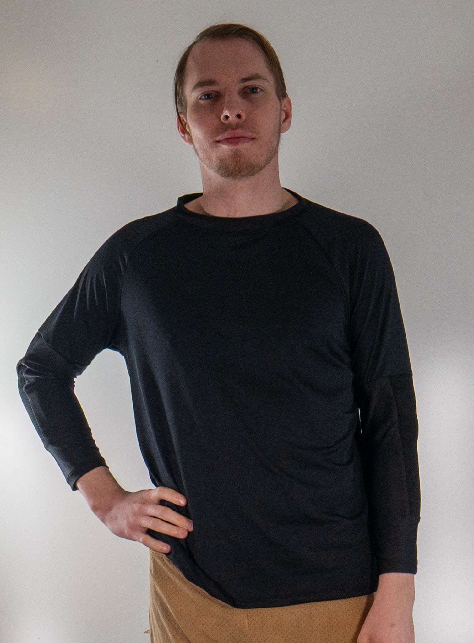 Men's G-Form Mountain Bike Jersey with removable elbow pads, breathable fabric, black, front view.