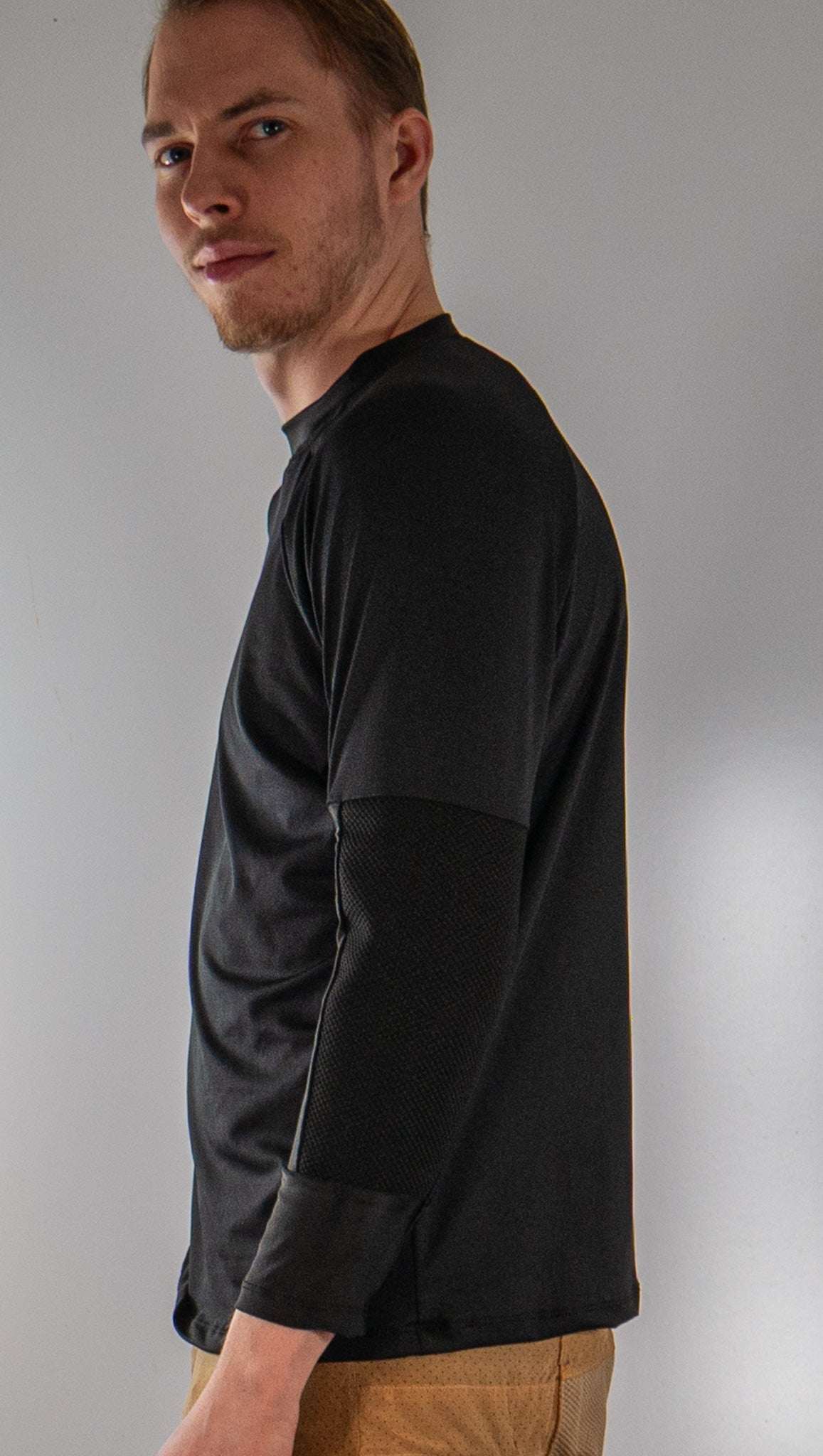 Men's G-Form Mountain Bike Jersey with removable elbow pads, breathable fabric, and loose fit.