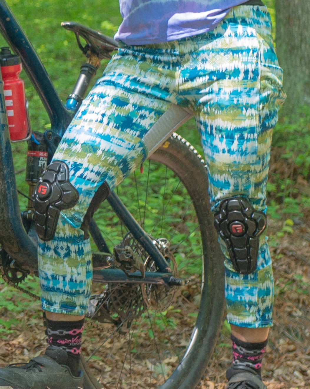 Trail pants with G-Form knee pads in boho style for biking.