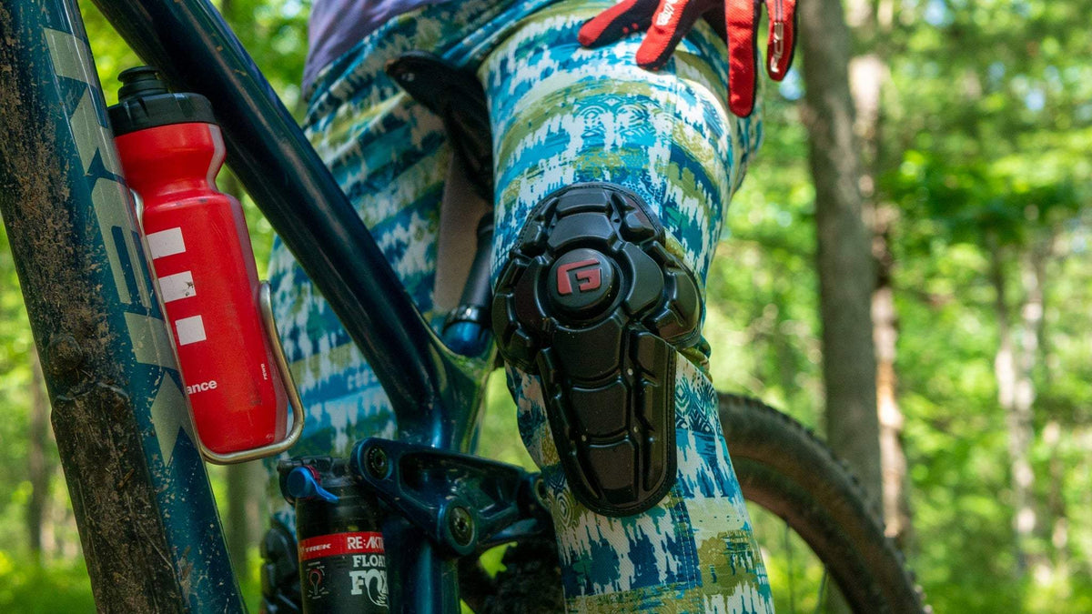 Bike pants with G-Form knee pads in boho pattern, perfect for female cyclists on trails.