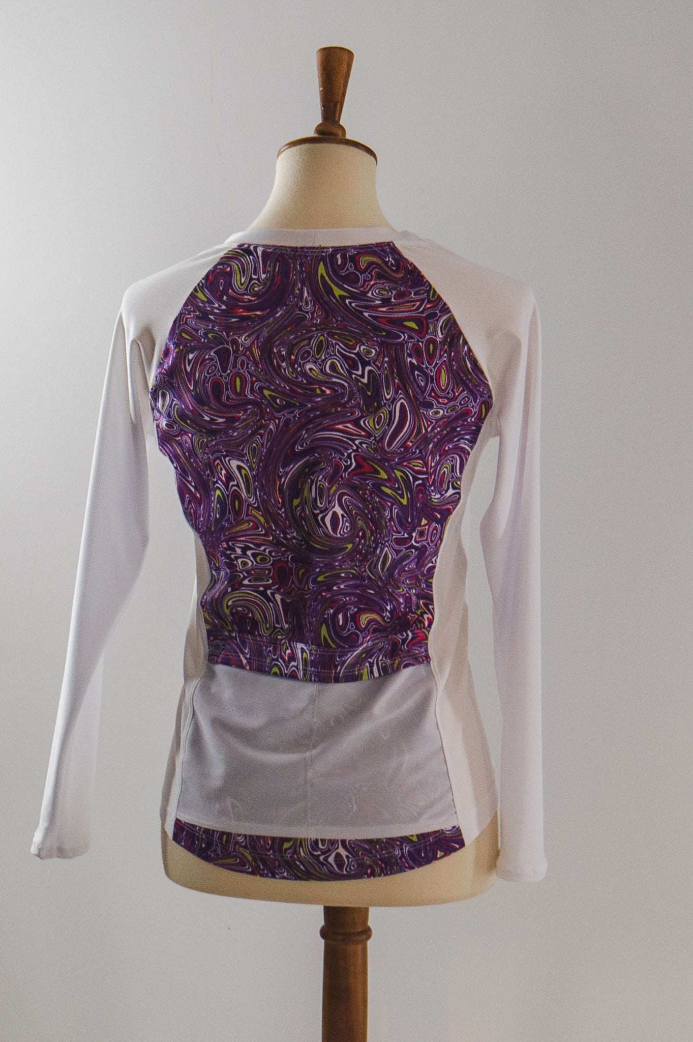 Moxie Tee Jersey Purple Paisley with long sleeves and perforated mesh fabric.