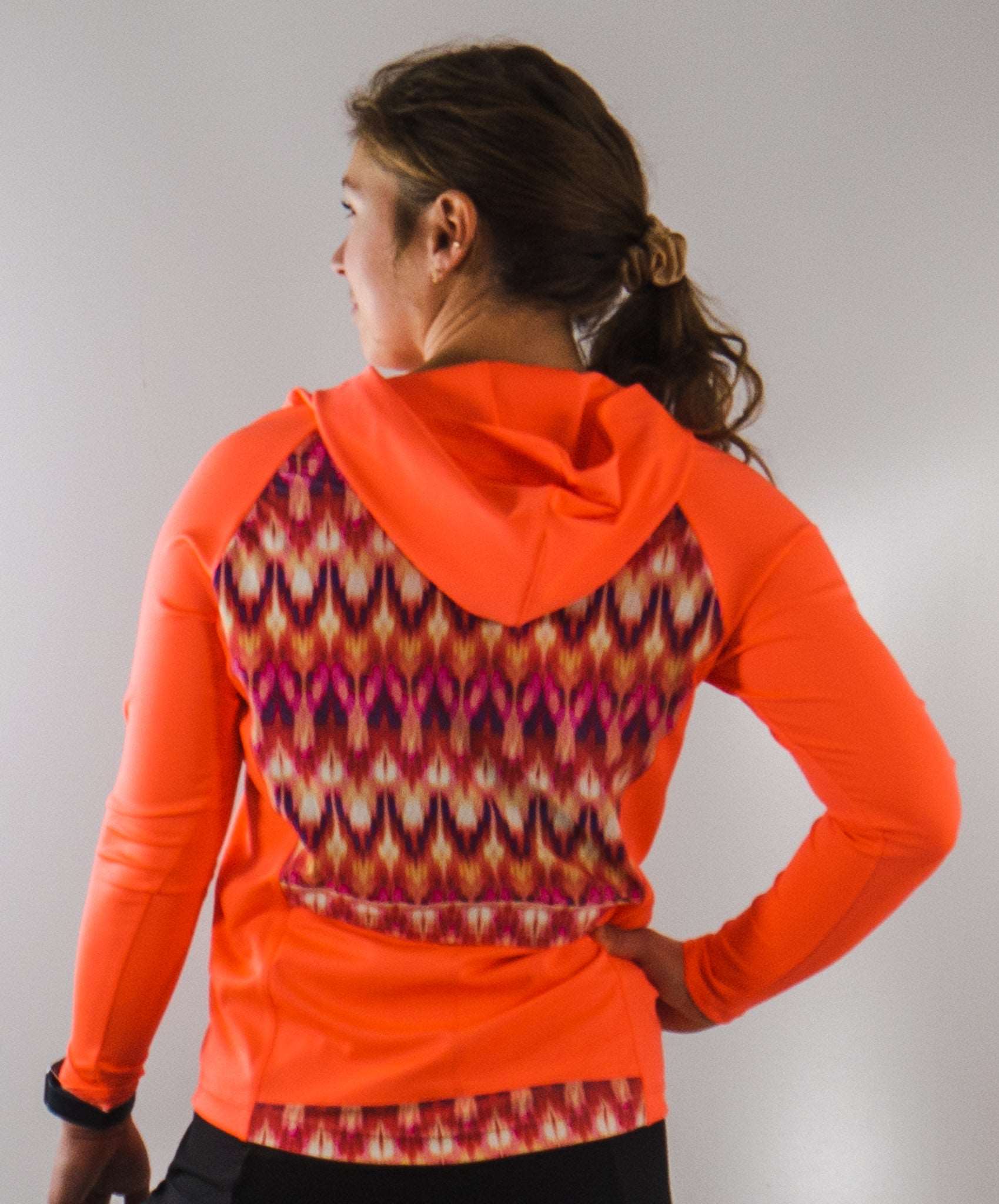 Moxie Tee Heavier Weight hoodie, orange long sleeve bike jersey, moisture-wicking, high visibility.