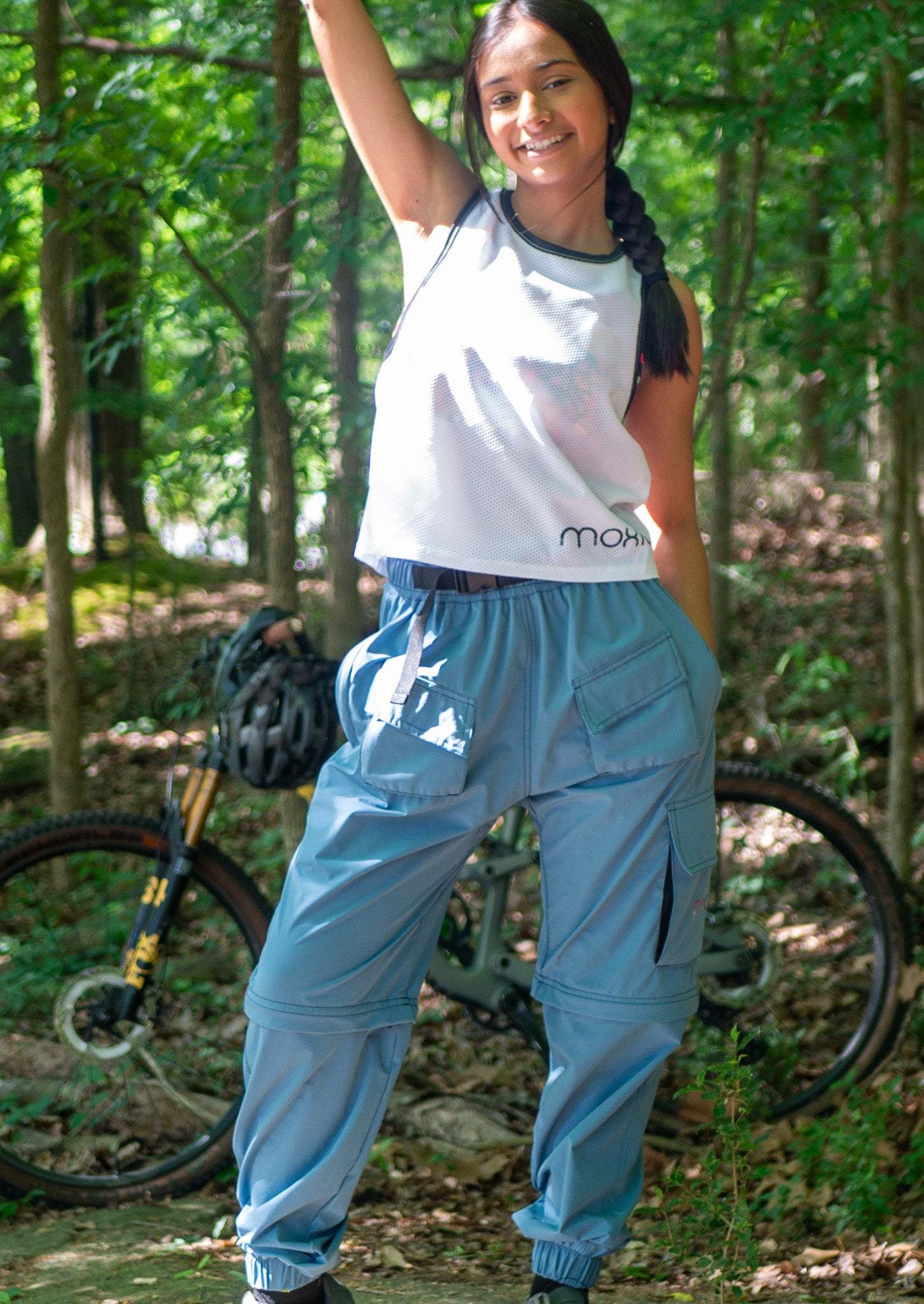 Women's conversion cargo mountain bike pants in dusty blue designed for versatile summer riding and technical performance