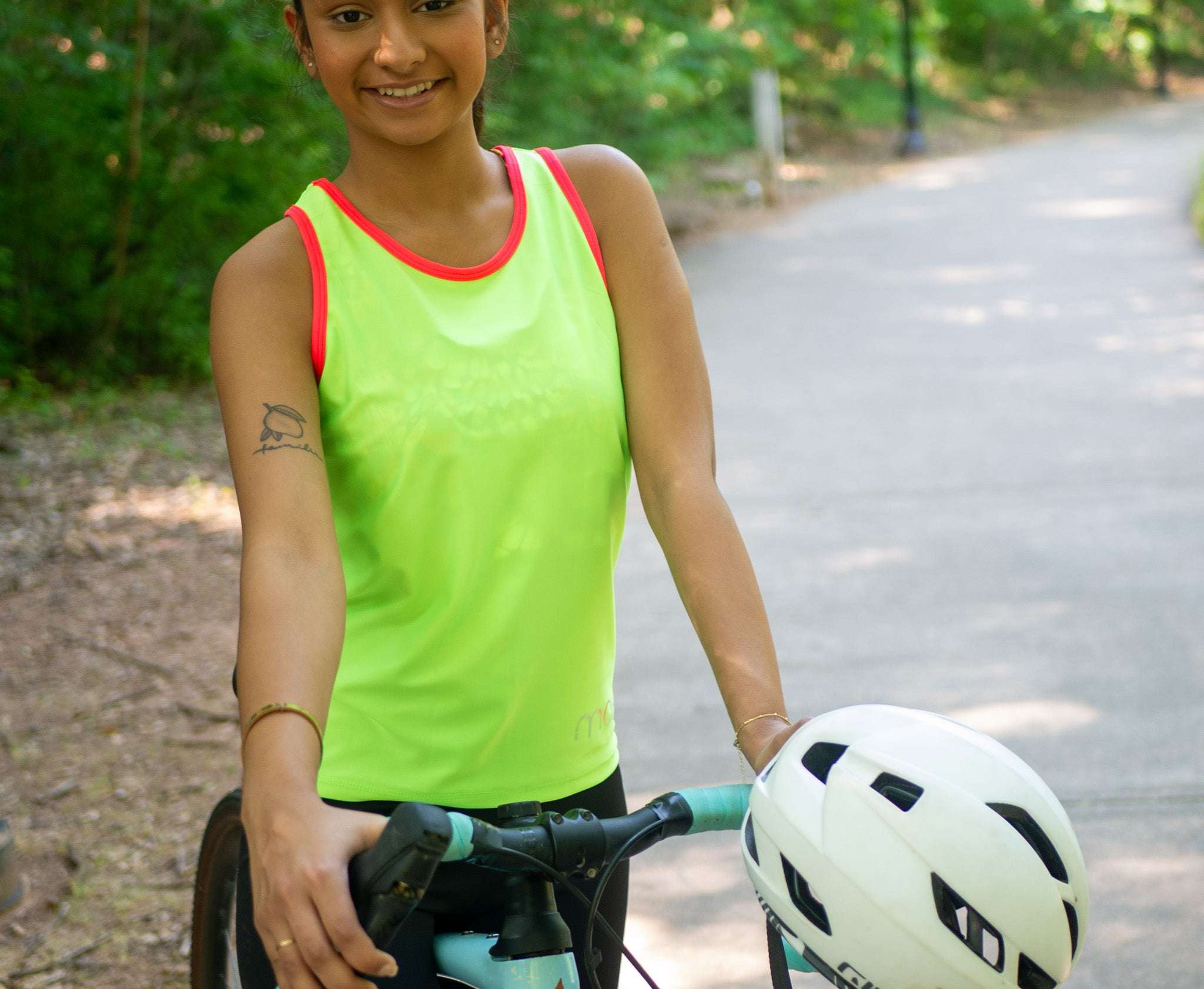 Women's sleeveless bike jersey in high vis colors with back pocket for essentials