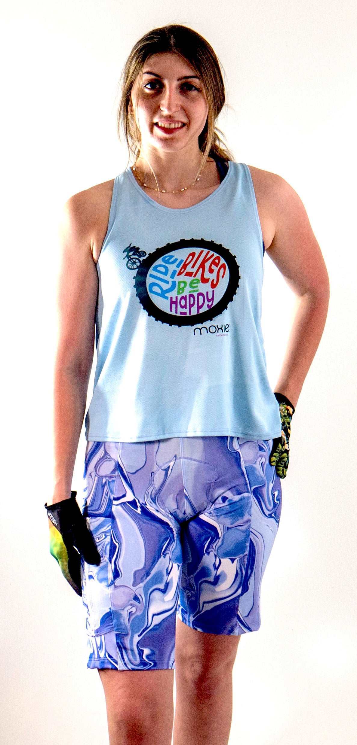 Light blue tank top with "Ride Bikes Be Happy" graphic, showcasing breathable mesh fabric and looser fit for mountain biking.