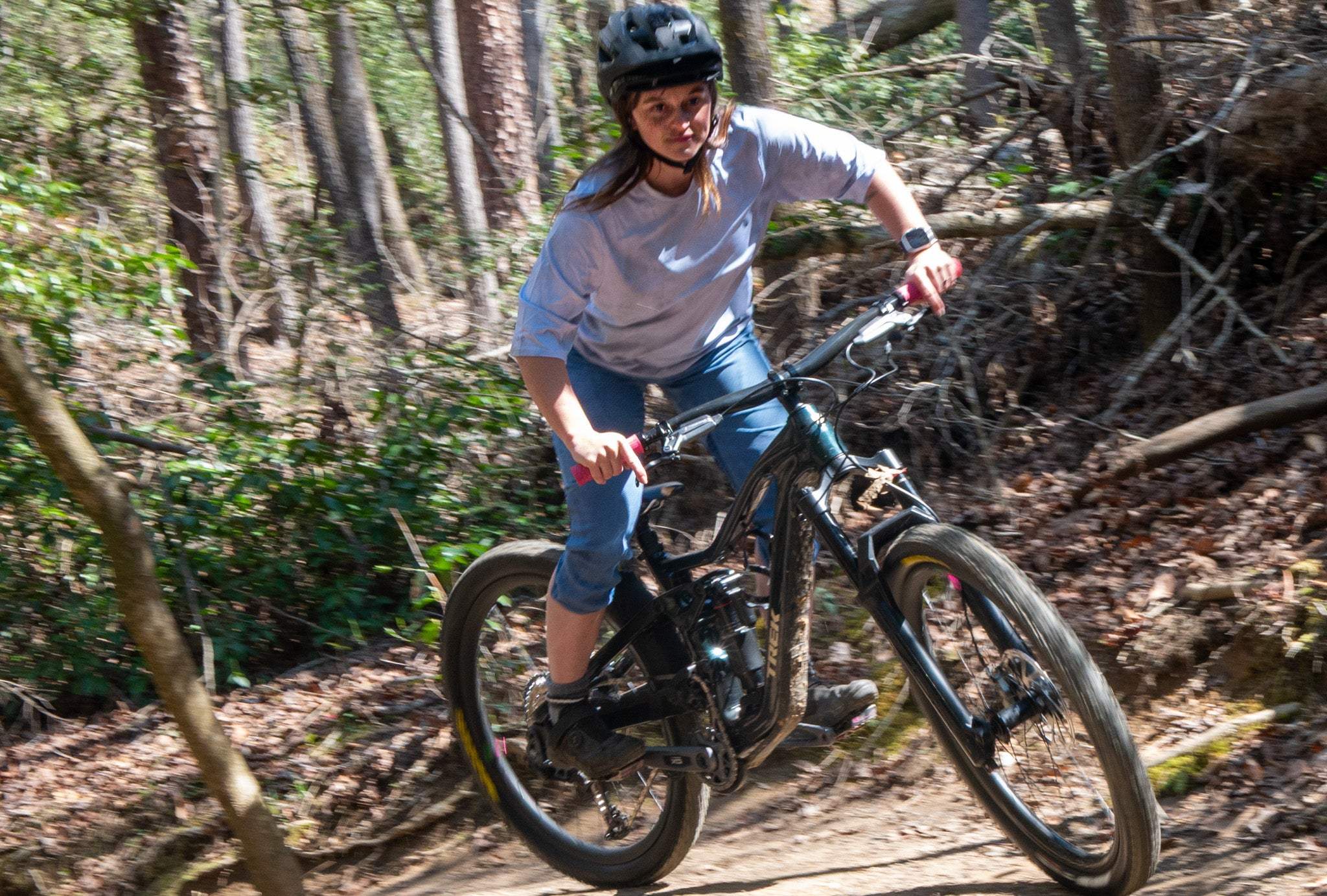 The Peak Jersey women's short-sleeve mountain bike jersey with Dirt and Ink graphics, hand-dyed and moisture-wicking mesh fabric