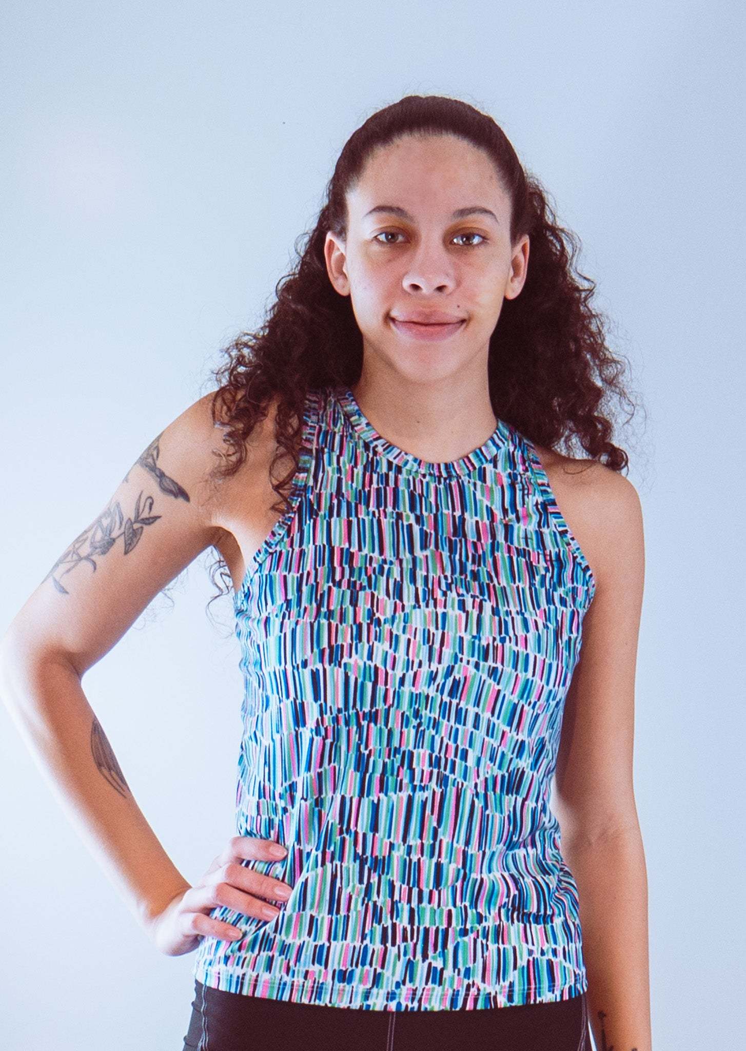 Women's sleeveless bike jersey with colorful pattern, breathable mesh fabric.