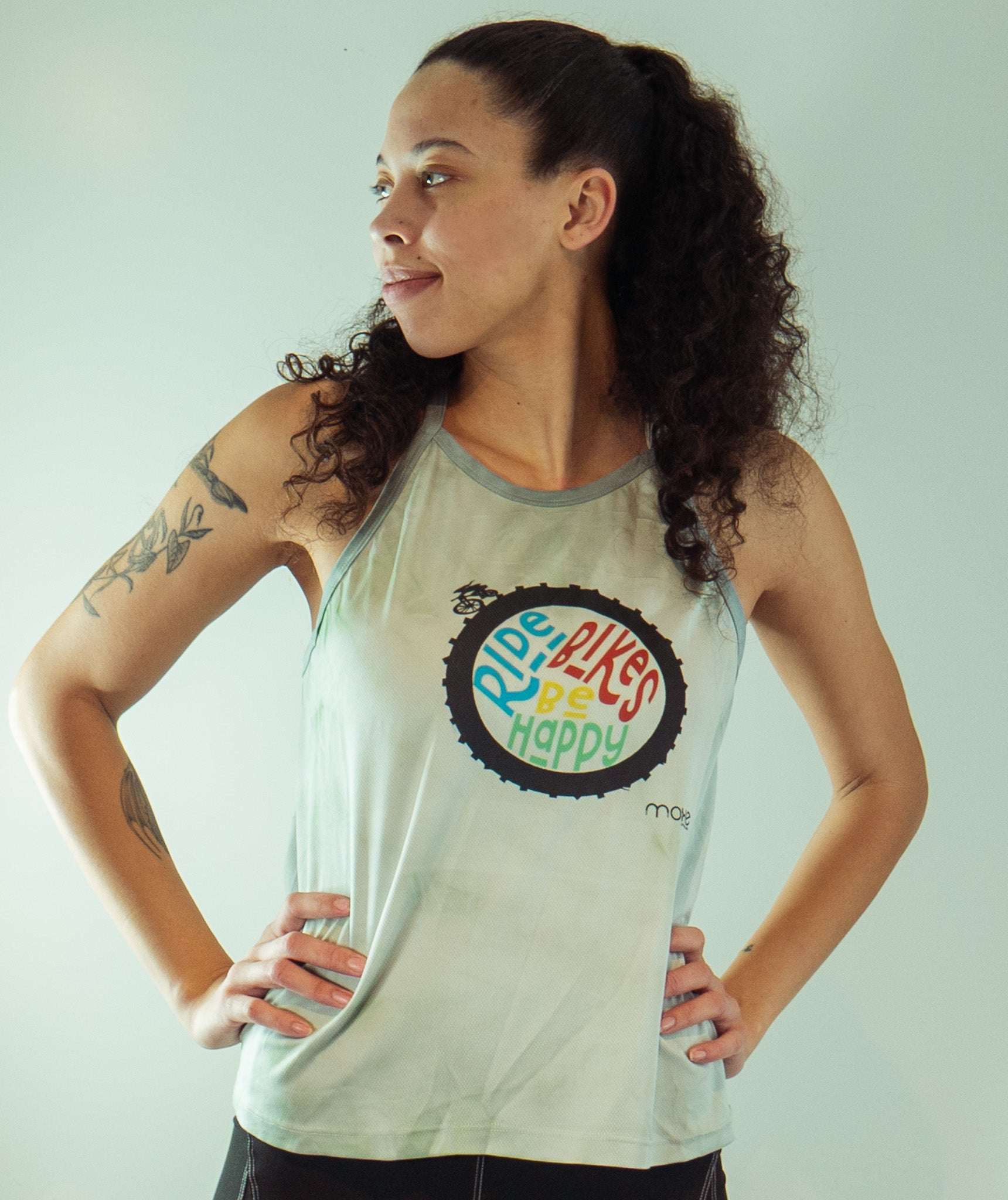 Women's sleeveless tie dye bike top with Ride Bikes Be Happy graphic and soft spandex fabric