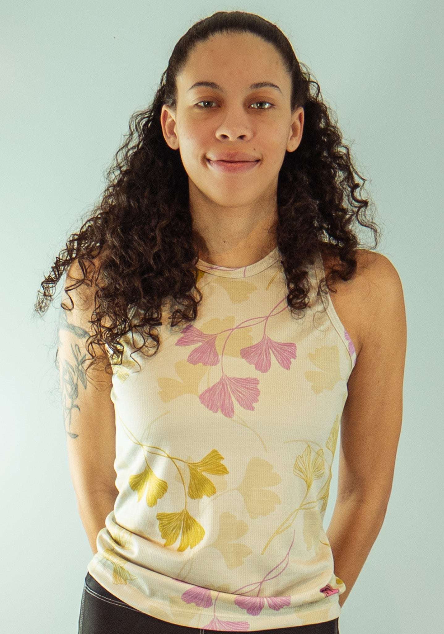 Women's sleeveless bike jersey with floral design and breathable mesh fabric.