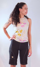 Women's sleeveless bike jersey with floral design, featuring breathable mesh fabric and back pocket.