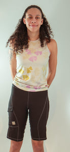 Women's sleeveless bike jersey with floral design, featuring breathable mesh fabric and back pocket for essentials.
