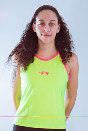 Women's sleeveless cycling jersey in neon green with pink trim and graphic, ideal for visibility and comfort.