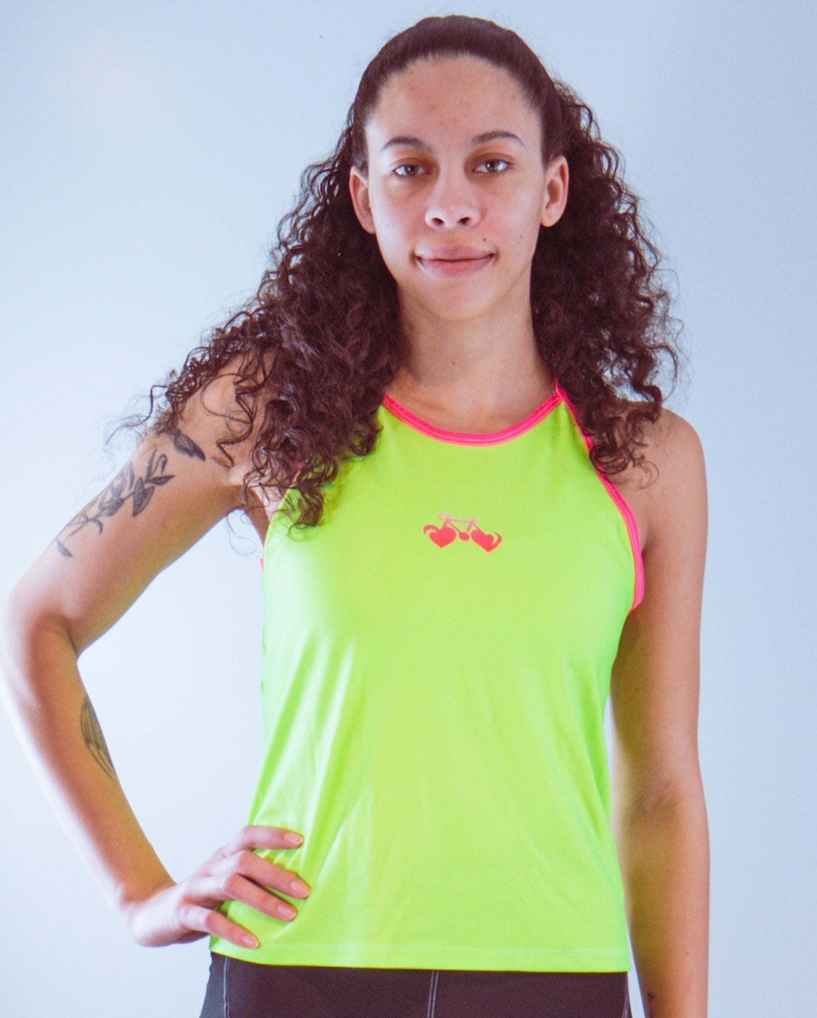 Women's sleeveless high-visibility bike jersey with a strappy design and back pocket.