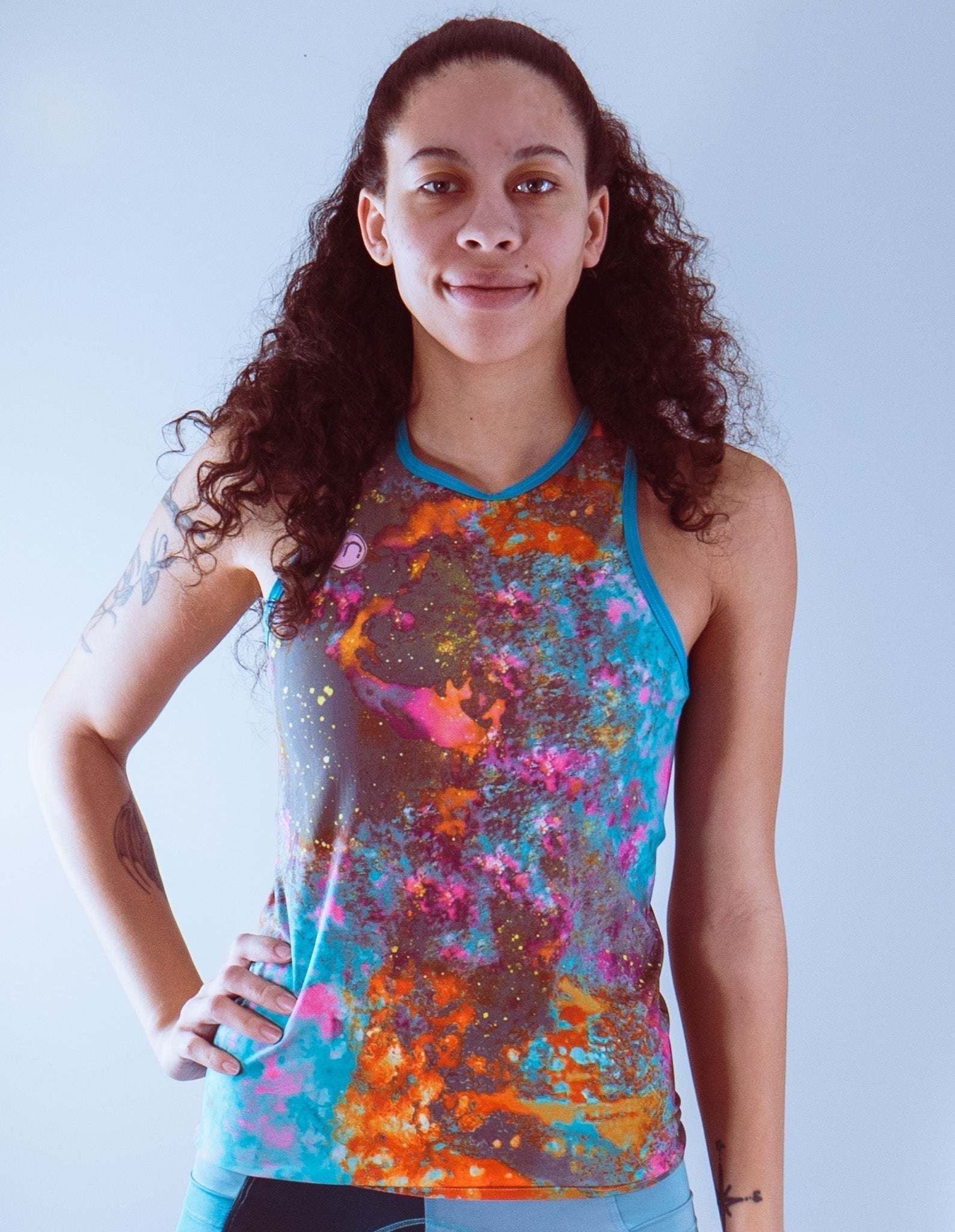 Women's sleeveless bike jersey with colorful design, breathable mesh fabric, and a back pocket.