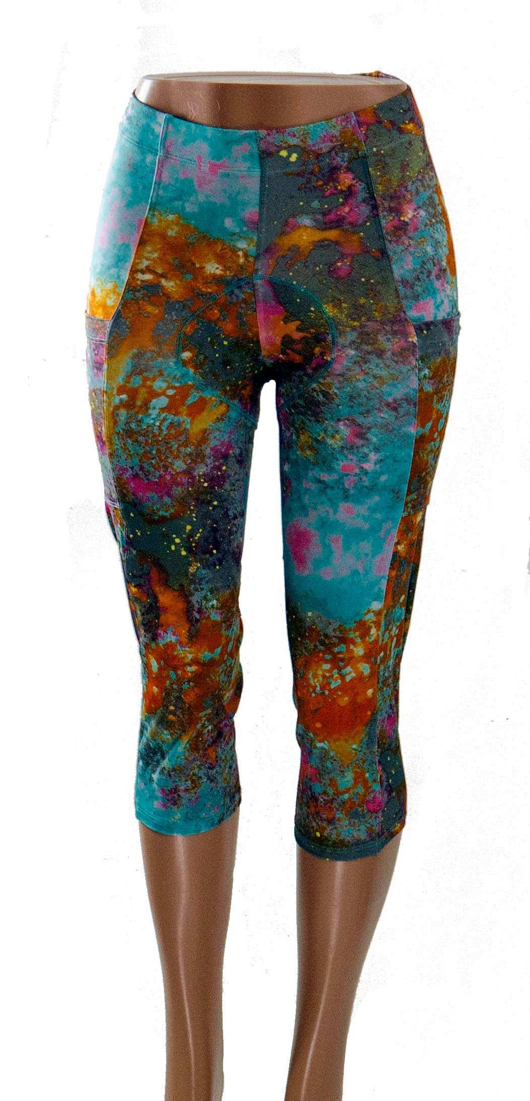 Women’s cycling knickers with colorful wild fire pattern, featuring Italian chamois, moisture-wicking fabric, and recycled stretch material.