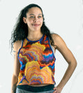 Woman wearing waffle-knit cropped tank mountain bike jersey riding on trail
